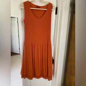 Fun year round dress.  Rust colored 100% polyester